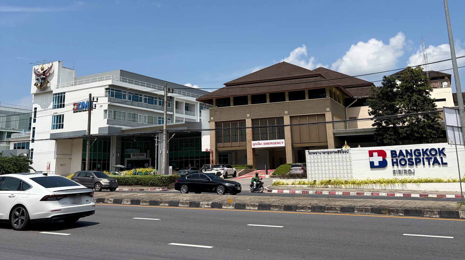 Bangkok Hospital Siriroj seen from the main road in Phuket Town, with the emergency entrance signposted