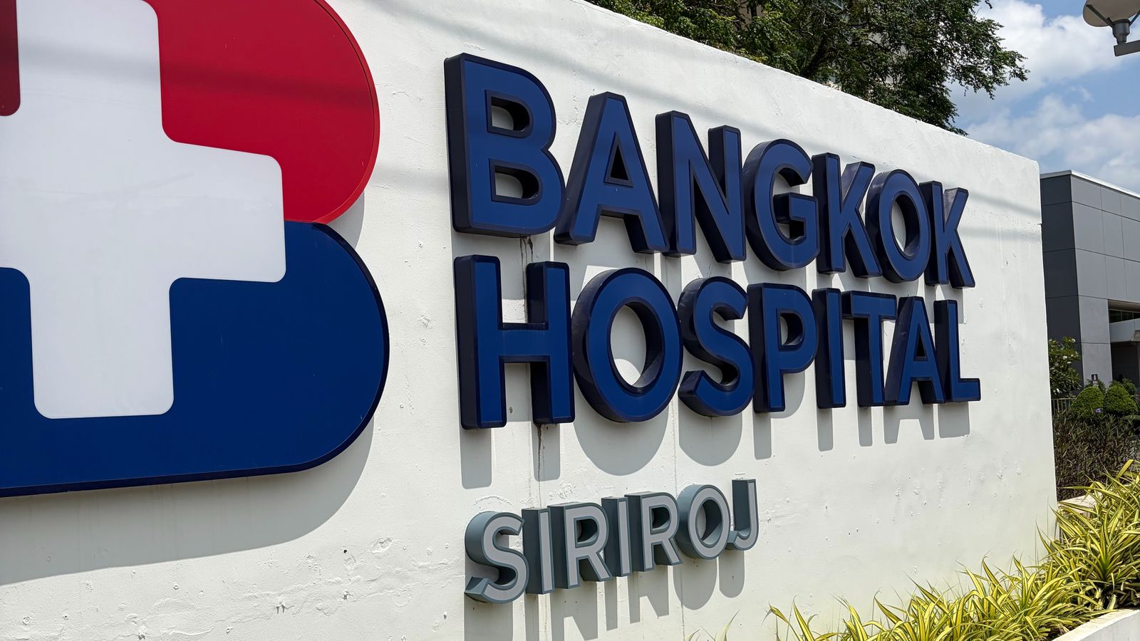 The Bangkok Hospital Siriroj sign on the street wall in Phuket Town